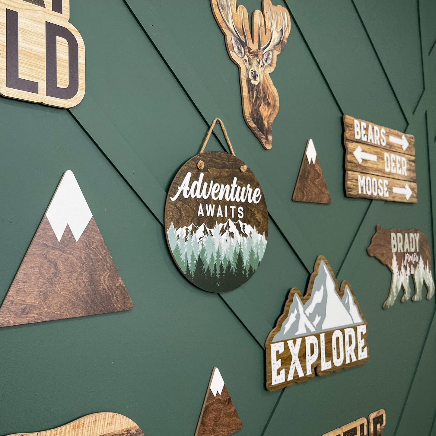 Adventure Awaits Hanging Wall Sign, 12" Wood Round, Green Trees Brown Background, Rustic Home Decor, Woodland Baby Shower Decorations,Hickory Hollow Designs (Adventure Awaits (Dark Walnut))
